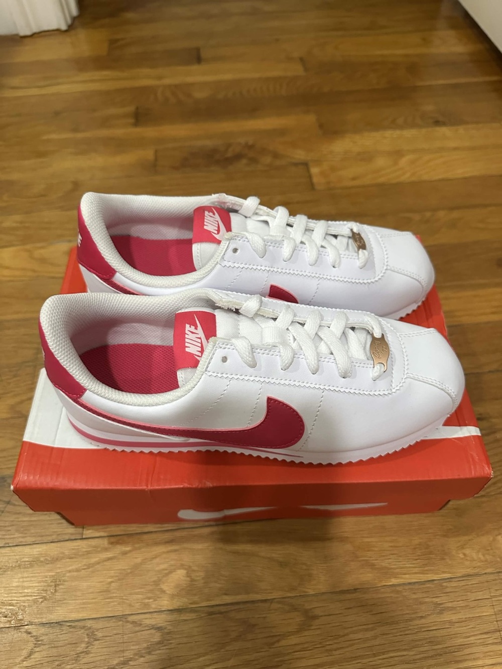 Nike Kids White Sneakers with Pink Swoosh